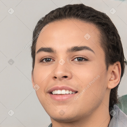 Joyful white young-adult male with short  black hair and brown eyes