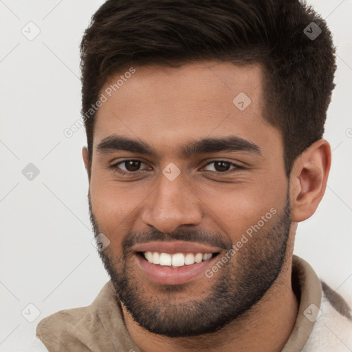 Joyful white young-adult male with short  brown hair and brown eyes