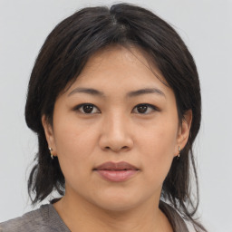 Neutral asian young-adult female with medium  brown hair and brown eyes