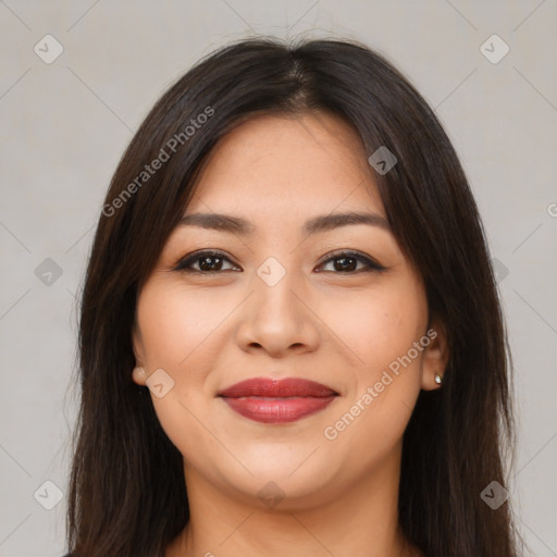 Joyful latino young-adult female with long  brown hair and brown eyes