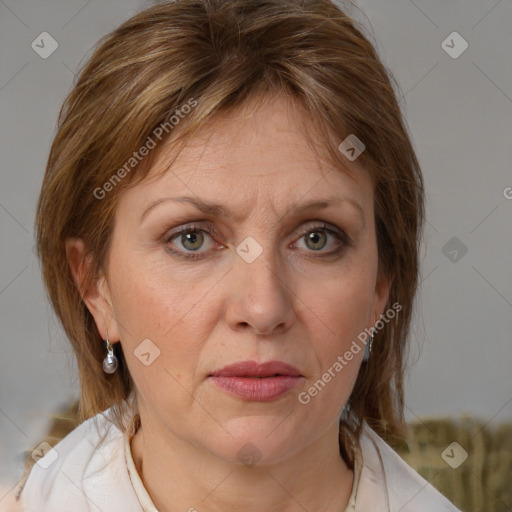 Joyful white adult female with medium  brown hair and grey eyes