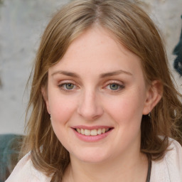 Joyful white young-adult female with medium  brown hair and blue eyes