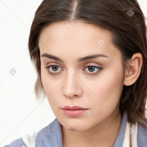 Neutral white young-adult female with long  brown hair and brown eyes