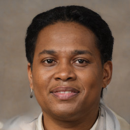 Joyful black adult male with short  brown hair and brown eyes