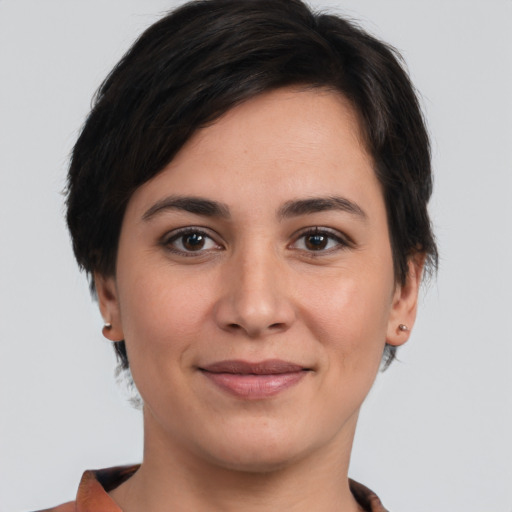 Joyful white young-adult female with short  brown hair and brown eyes