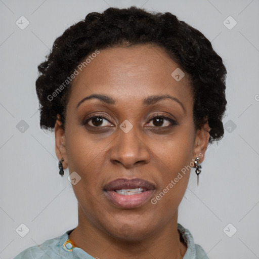 Joyful black adult female with short  brown hair and brown eyes