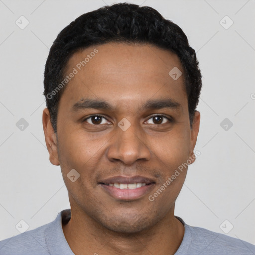 Joyful black young-adult male with short  black hair and brown eyes