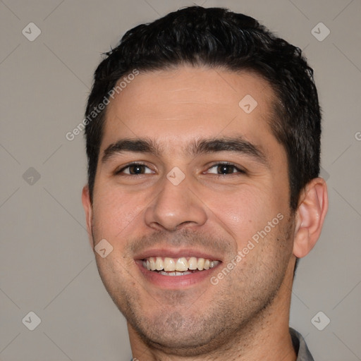 Joyful white young-adult male with short  black hair and brown eyes