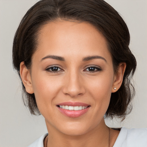 Joyful white young-adult female with medium  brown hair and brown eyes