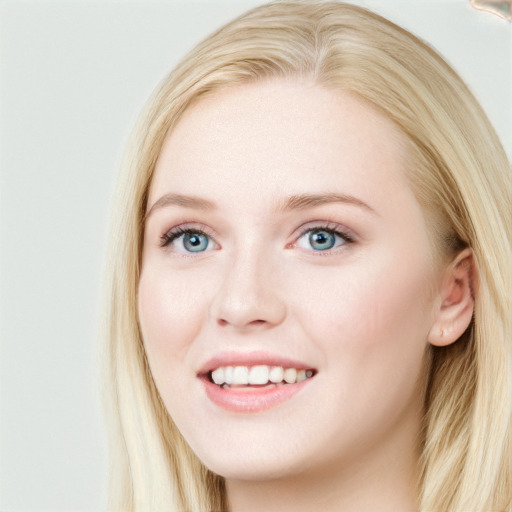 Joyful white young-adult female with long  brown hair and blue eyes