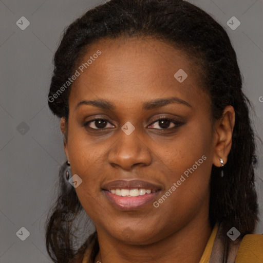 Joyful black young-adult female with long  brown hair and brown eyes