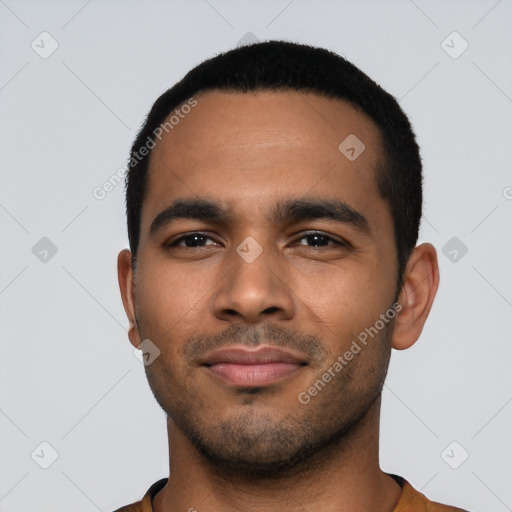 Joyful latino young-adult male with short  black hair and brown eyes