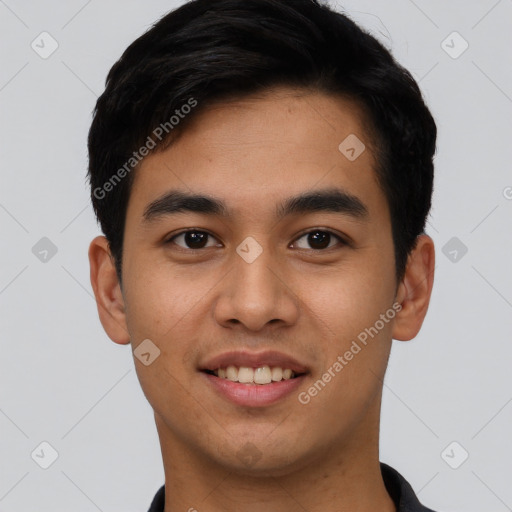 Joyful asian young-adult male with short  black hair and brown eyes