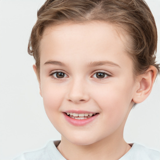 Joyful white child female with short  brown hair and brown eyes