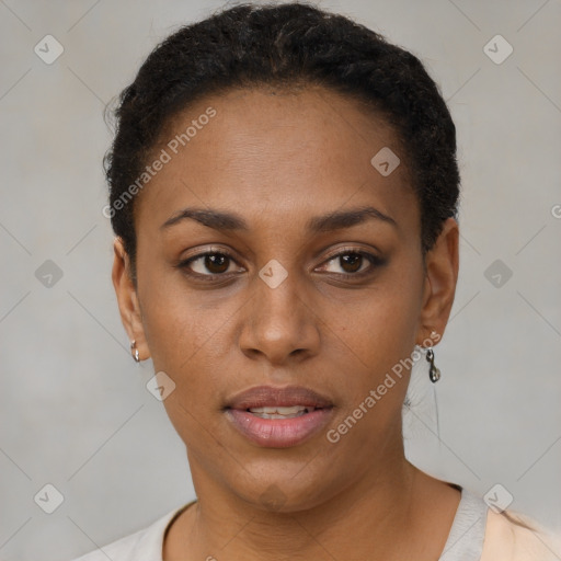 Joyful black young-adult female with short  brown hair and brown eyes