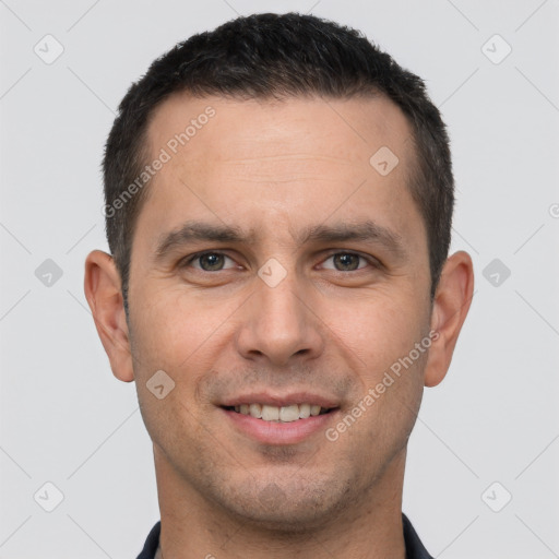 Joyful white young-adult male with short  brown hair and brown eyes