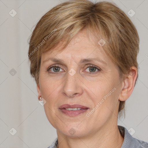 Joyful white adult female with medium  brown hair and grey eyes