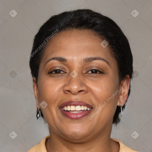 Joyful latino adult female with short  brown hair and brown eyes