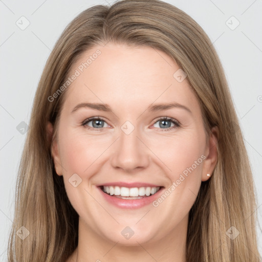 Joyful white young-adult female with long  brown hair and grey eyes