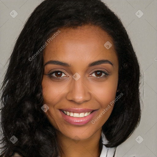 Joyful black young-adult female with long  brown hair and brown eyes