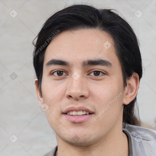 Joyful white young-adult male with short  black hair and brown eyes