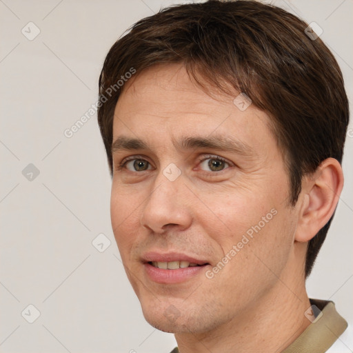 Joyful white adult male with short  brown hair and brown eyes