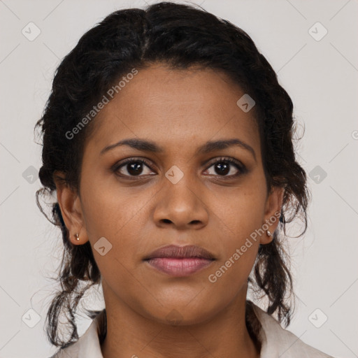 Joyful black young-adult female with medium  brown hair and brown eyes