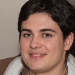 Joyful white young-adult male with medium  brown hair and brown eyes