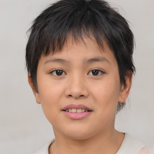 Joyful asian child female with short  brown hair and brown eyes