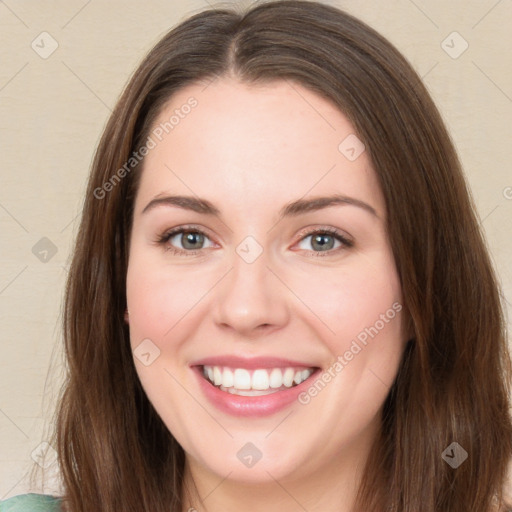 Joyful white young-adult female with long  brown hair and green eyes