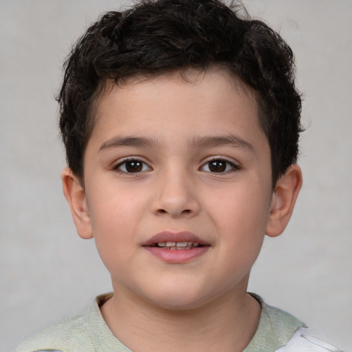 Joyful white child male with short  brown hair and brown eyes