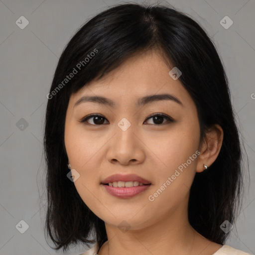 Joyful asian young-adult female with medium  black hair and brown eyes