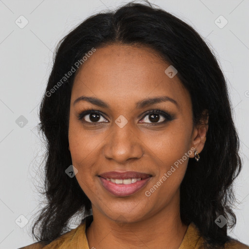 Joyful black young-adult female with long  brown hair and brown eyes