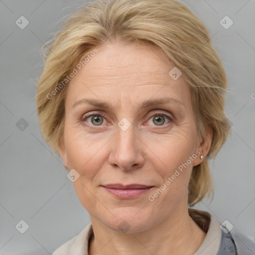 Joyful white adult female with medium  brown hair and blue eyes