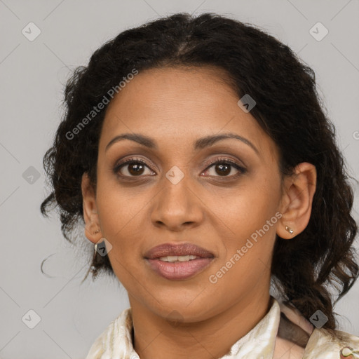 Joyful black adult female with medium  brown hair and brown eyes