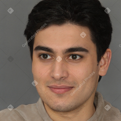 Joyful latino young-adult male with short  brown hair and brown eyes