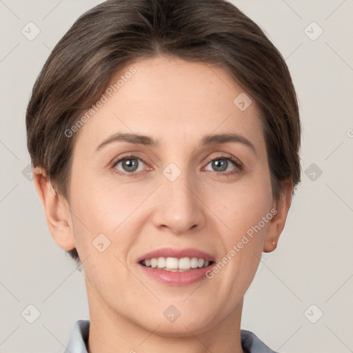 Joyful white young-adult female with short  brown hair and grey eyes