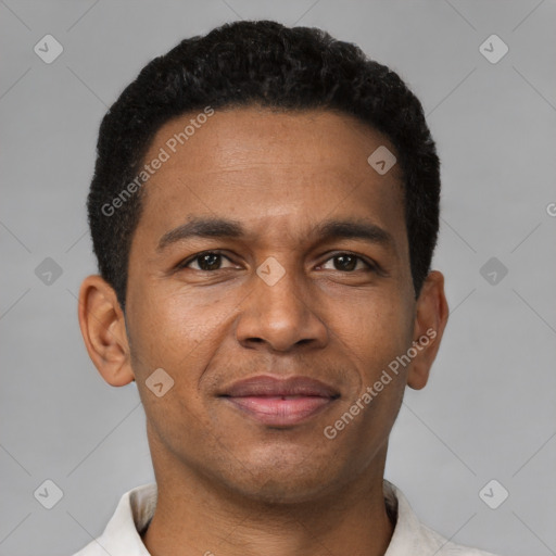 Joyful latino young-adult male with short  brown hair and brown eyes