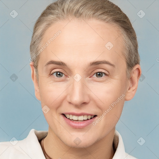 Joyful white adult female with short  brown hair and brown eyes