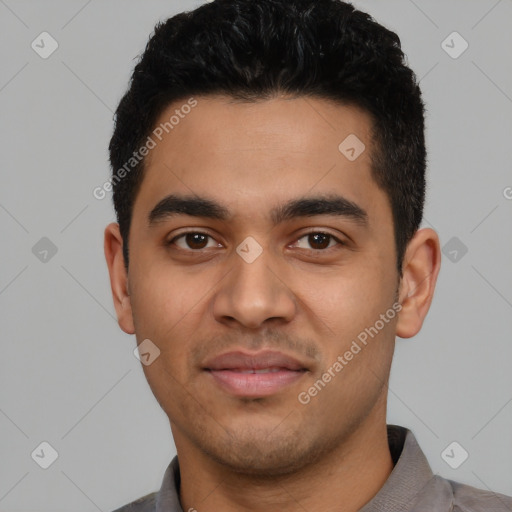 Joyful latino young-adult male with short  black hair and brown eyes