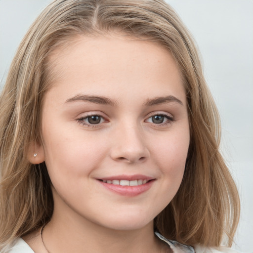 Joyful white child female with medium  brown hair and grey eyes