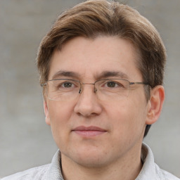 Joyful white adult male with short  brown hair and grey eyes