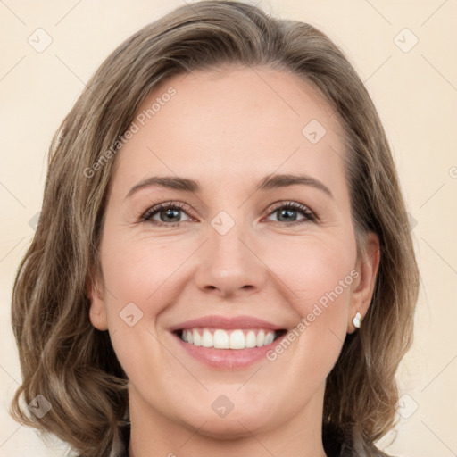 Joyful white young-adult female with medium  brown hair and green eyes