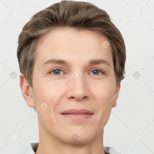 Joyful white adult male with short  brown hair and grey eyes