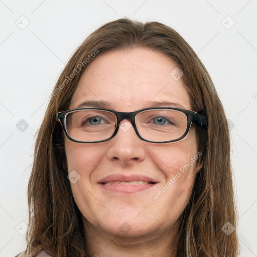 Joyful white young-adult female with long  brown hair and blue eyes