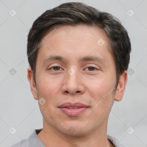 Joyful white adult male with short  brown hair and brown eyes