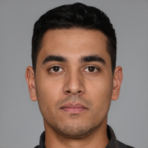 Neutral white young-adult male with short  black hair and brown eyes