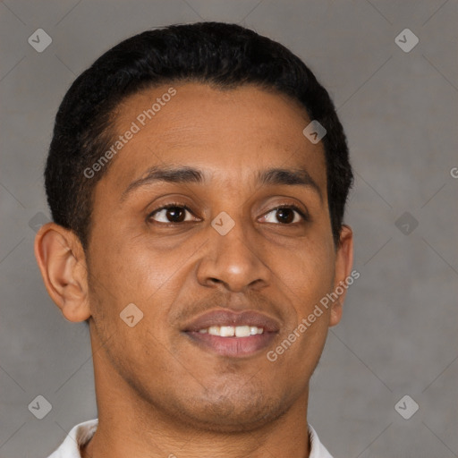 Joyful latino young-adult male with short  brown hair and brown eyes