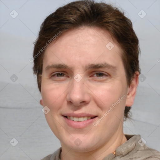 Joyful white adult male with short  brown hair and grey eyes