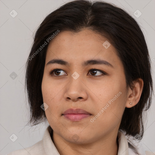 Joyful asian young-adult female with medium  brown hair and brown eyes